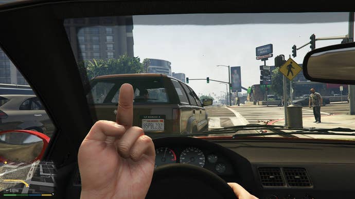 Player character gives a pedestrian the finger in first-person mode in GTA V.