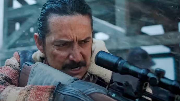 Gabriel Luna as Tommy aiming a gun in The Last of Us season two