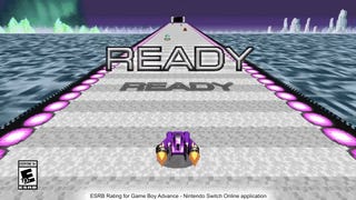 Screenshot from F-Zero Maximum Velocity trailer showing purple vehicle speeding towards a Switch console with READY on screen