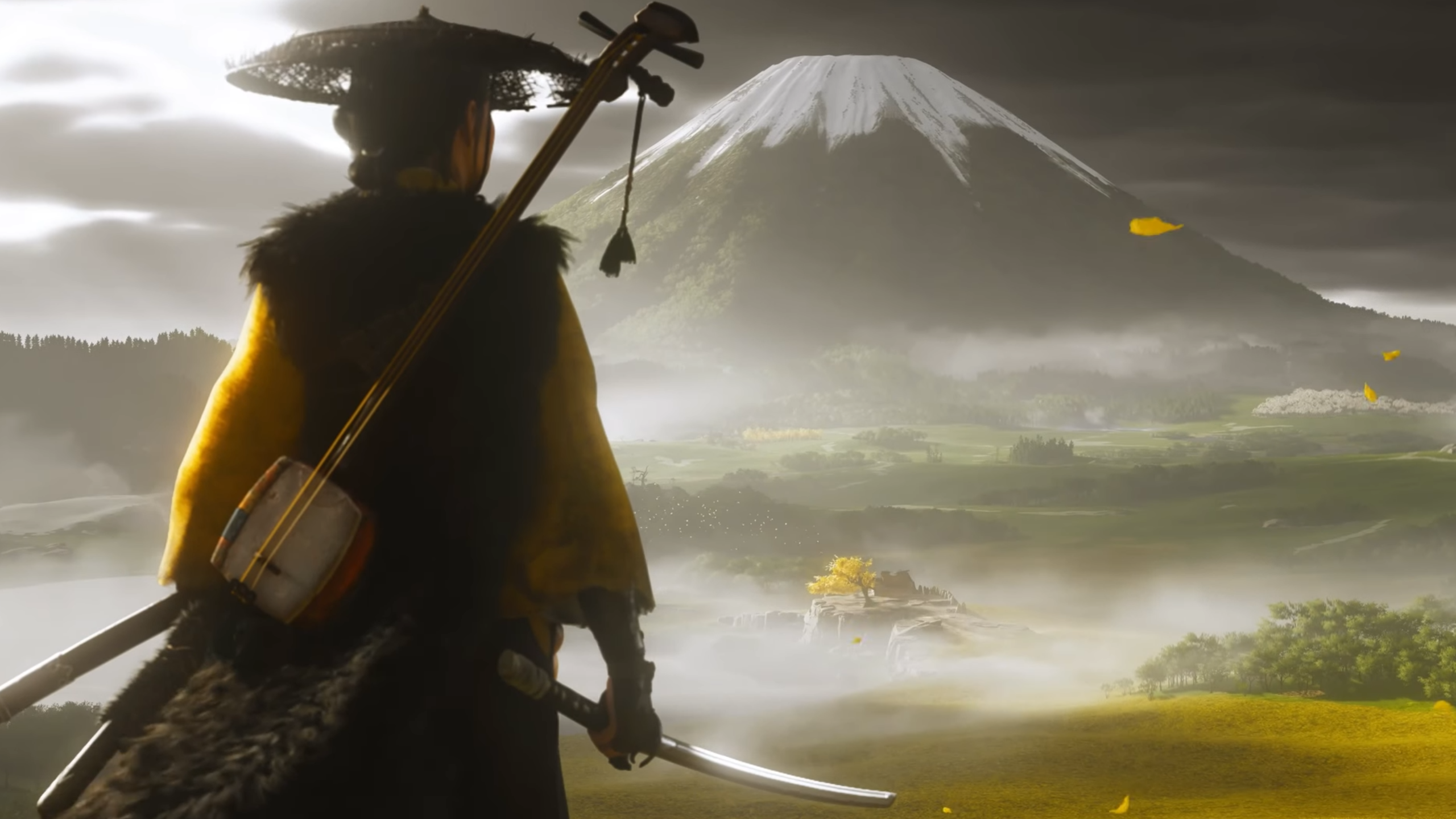 Ghost of Yotei trailer screenshot showing new female protagonist Ghost from behind looking out at towering mountain