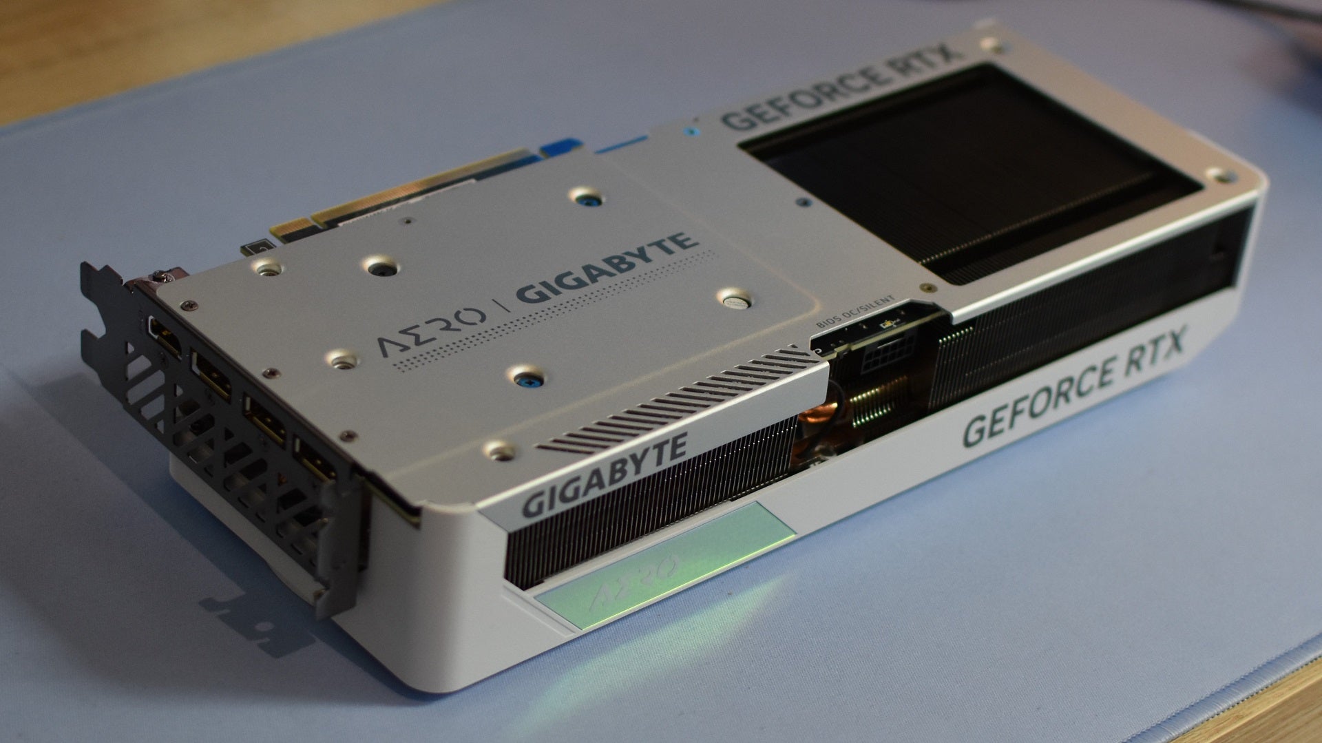 The underside of the Gigabye GeForce RTX 4070 Super Aero OC graphics card, resting on a desk. - 9