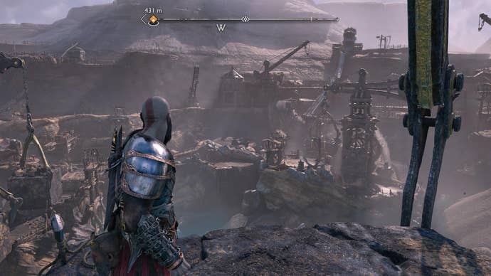 God of War Ragnarok review - Kratos looking out over many mining contraptions in Svartalfheim