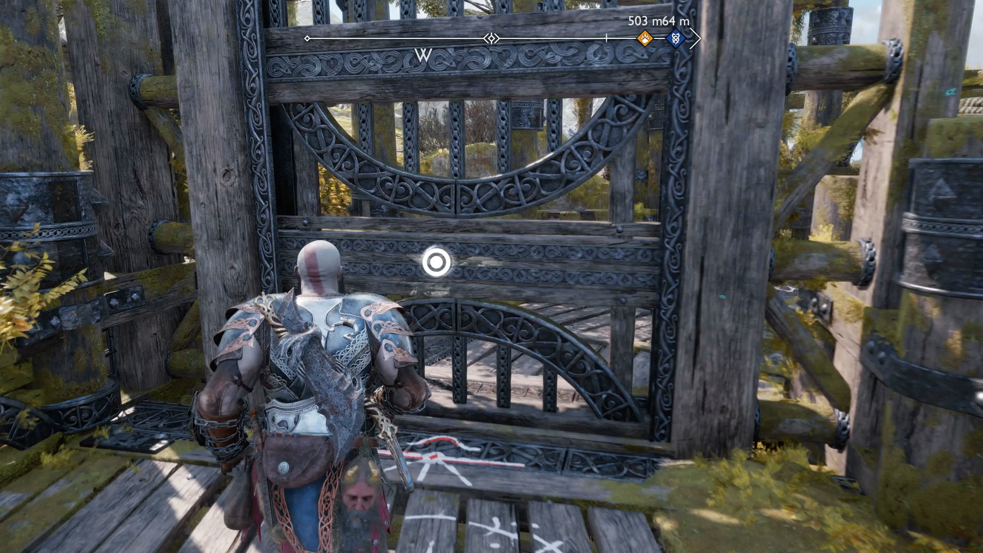 Kratos opening a large metal gate in God of War Ragnarok - 19