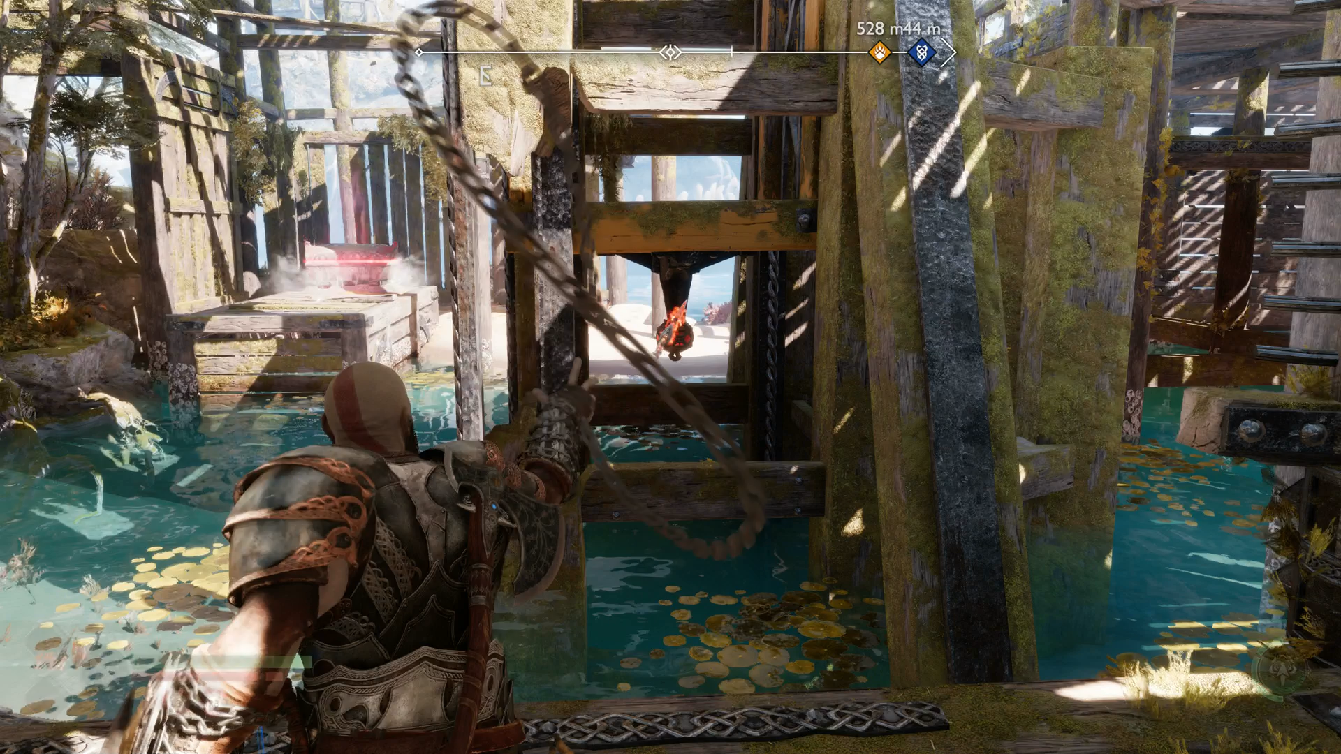 Kratos using his Blades of Chaos to lift a platform on Althjof&rsquo;s Rig in God of War Ragnarok