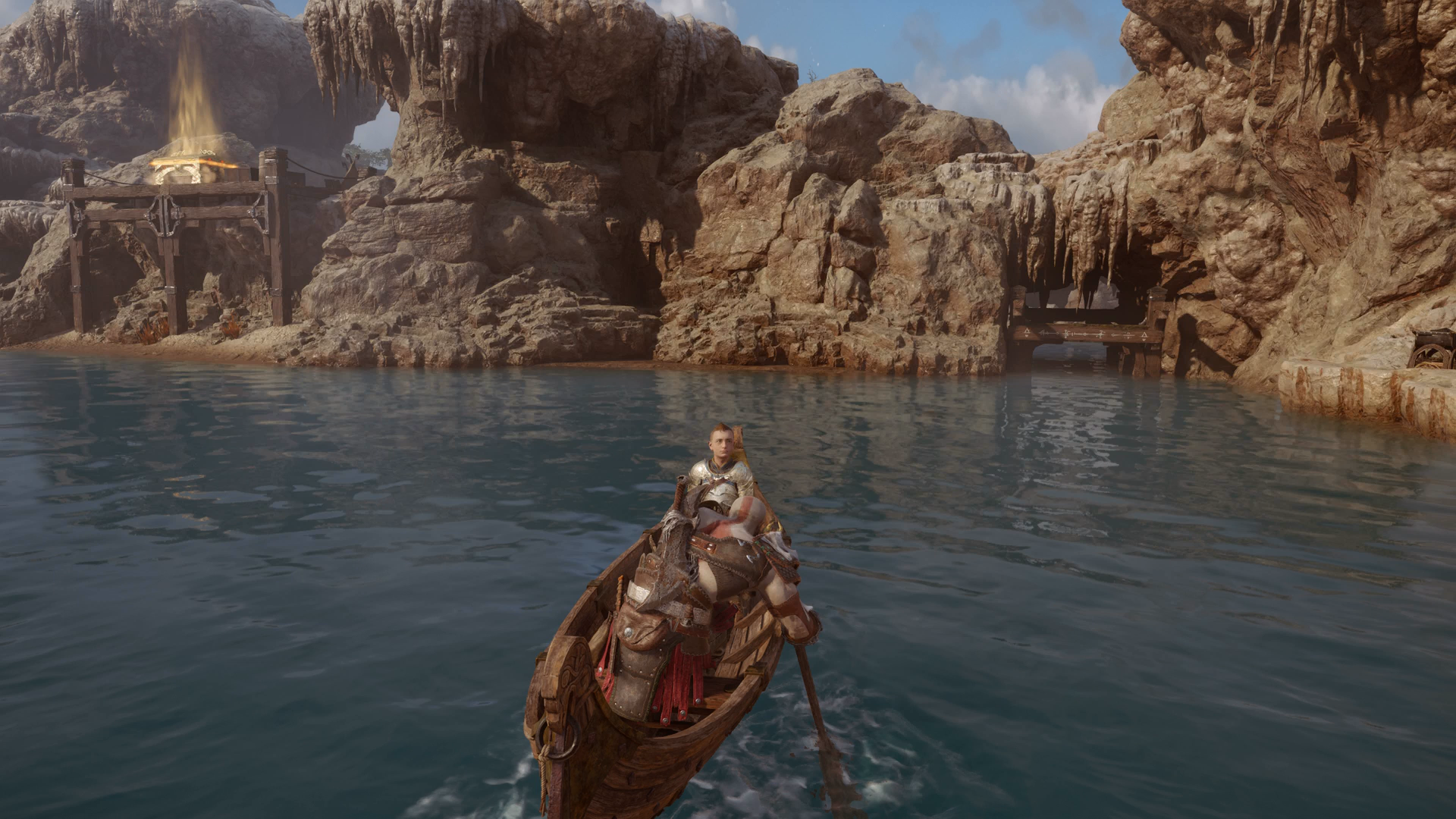 Kratos finding the secret path to the glowing chest in the Aurvangar Wetlands in God of War Ragnarok