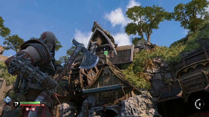 Kratos surveying the town square in the Dwarven city of Nidavellir in God of War Ragnarok