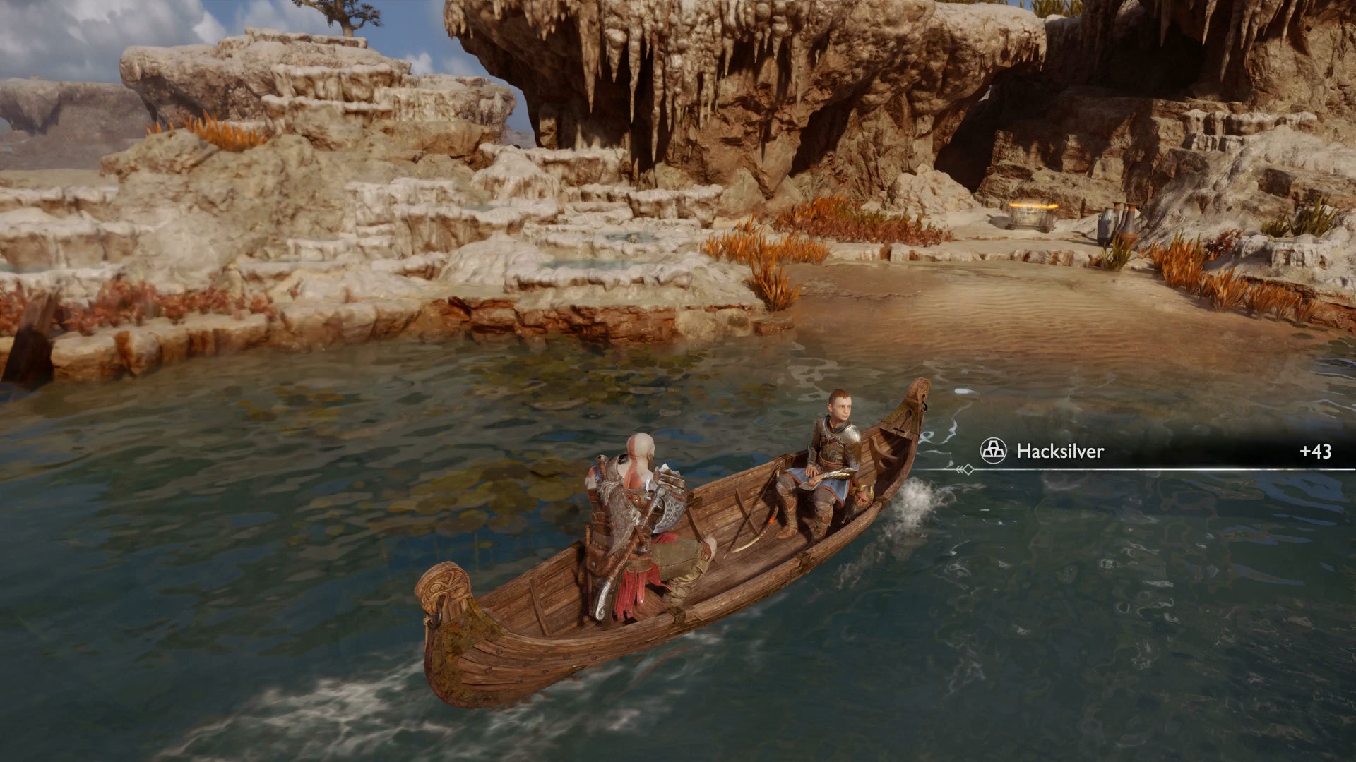 Kratos and Atreus row a boat towards a cache in the Aurvangar Wetlands in God of War Ragnarok - 4