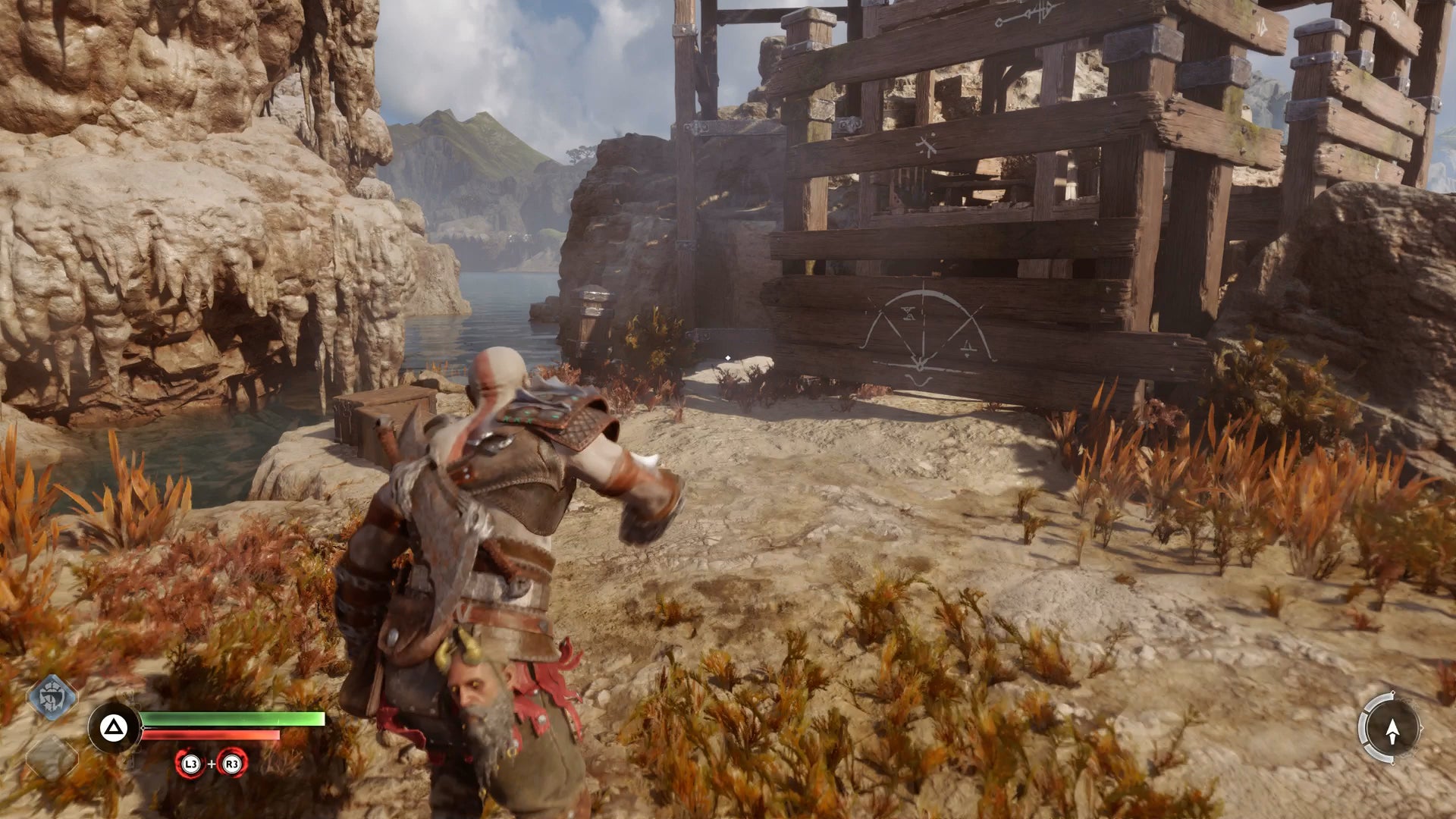 Kratos climbing the path around the water wheel in God of War Ragnarok - 8