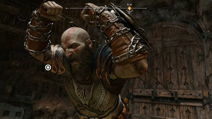 Kratos pulls open a door while wearing Nidavellir’s Finest Plackart, one of the best armor sets in God of War Ragnarok