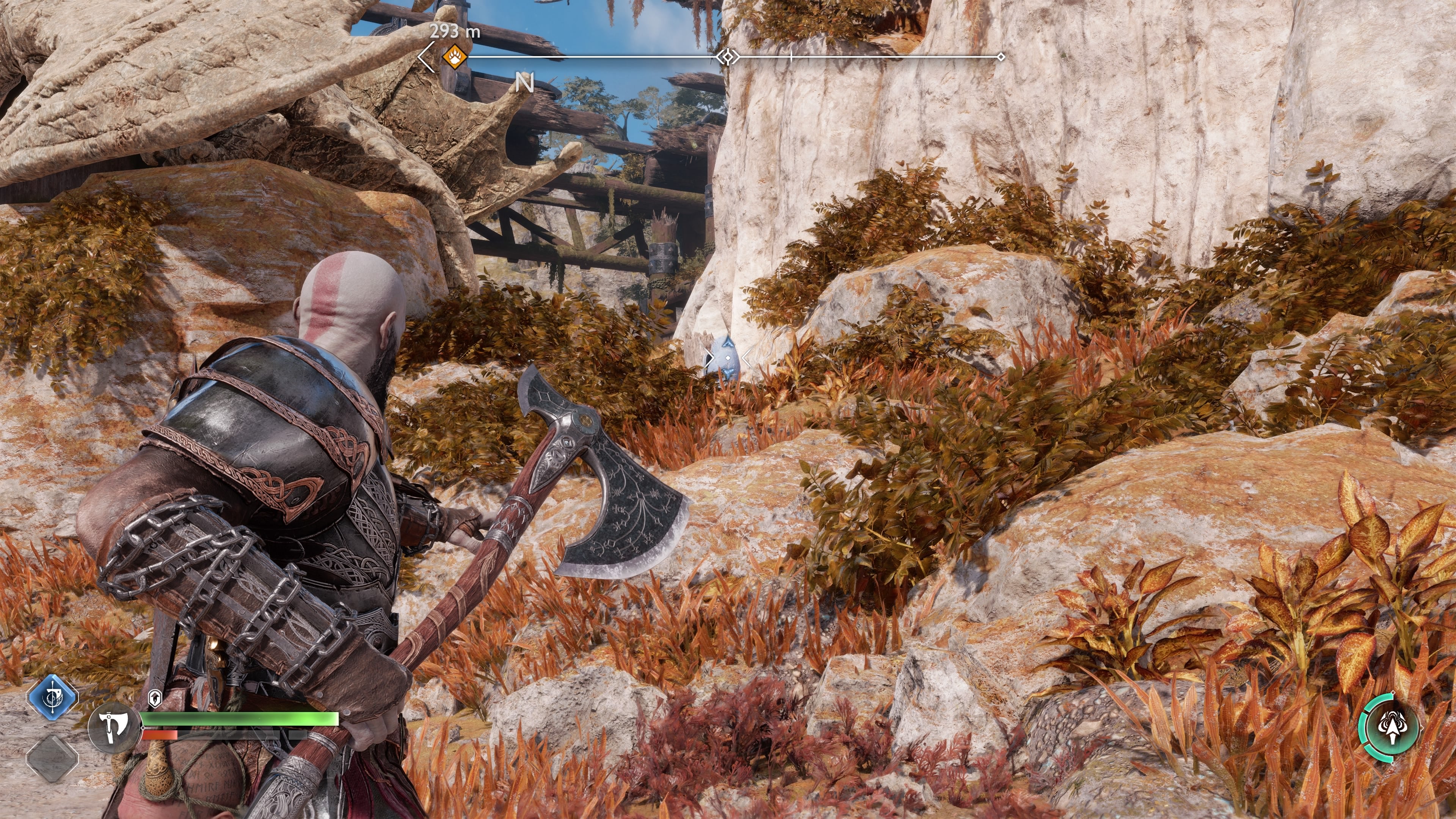 Kratos lines up a suitable vantage point to destroy the second idol statue on Dragon Beach in God of War Ragnarok