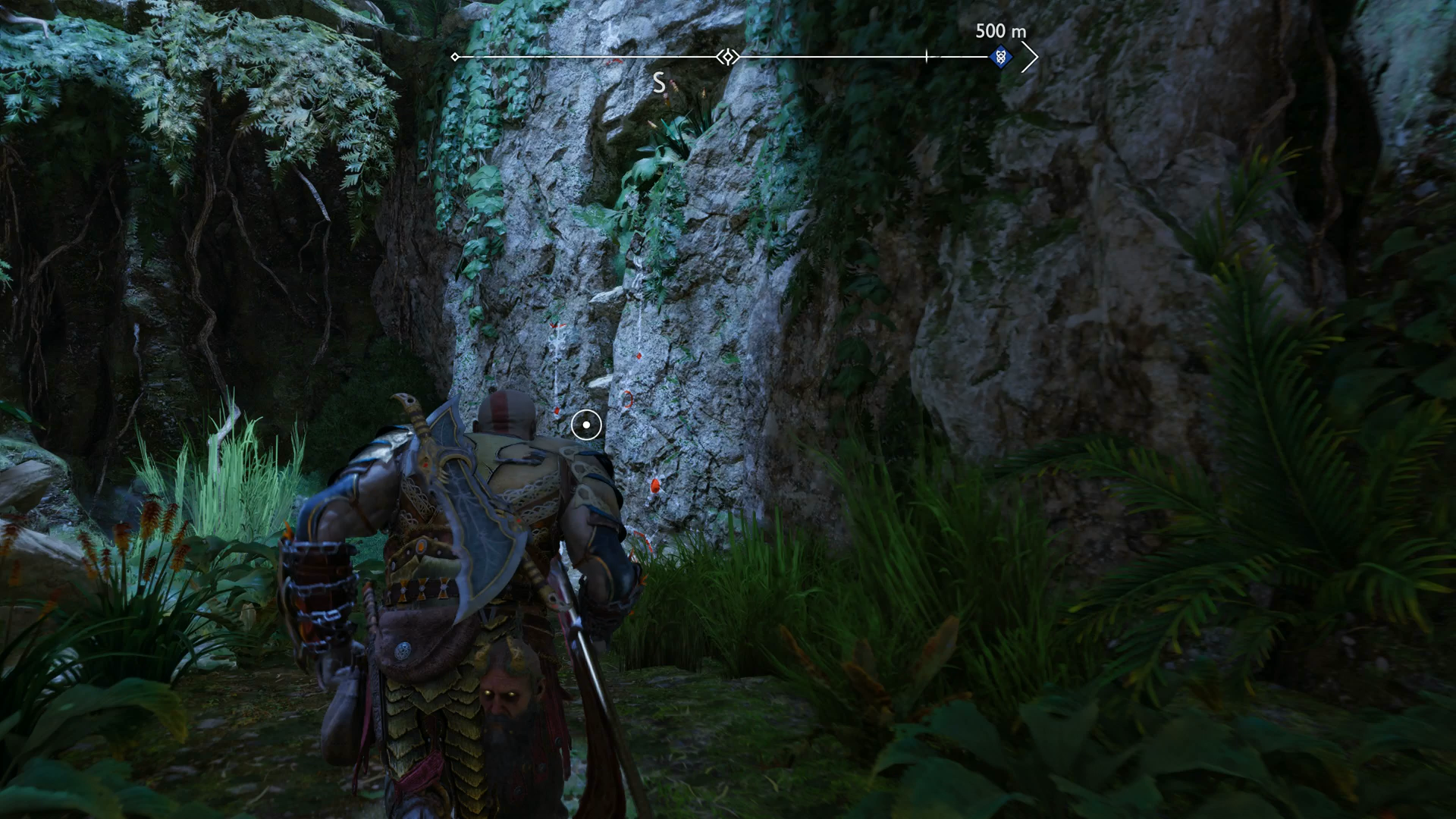 Kratos climbing a craggy wall in God of War Ragnarok