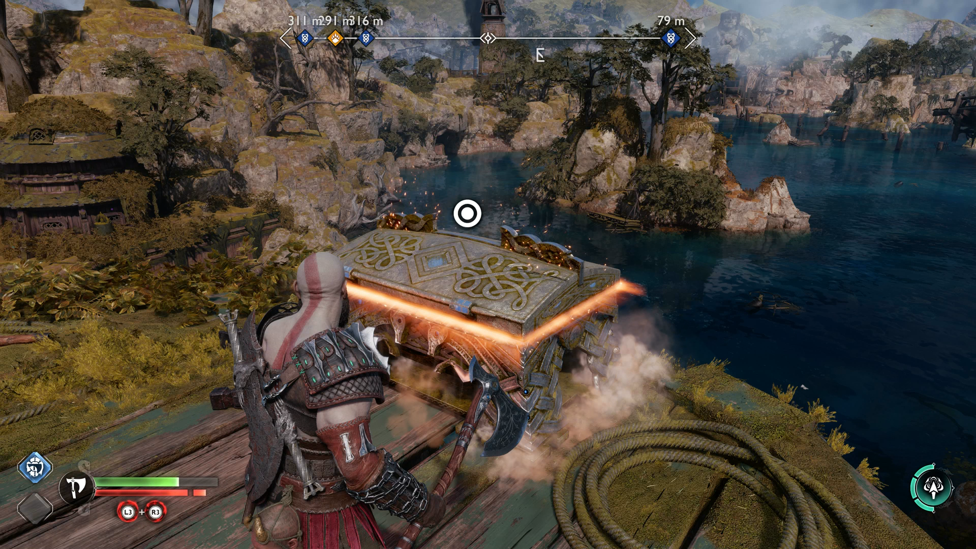 Kratos stands over a glowing item cache in God of War Ragnarok