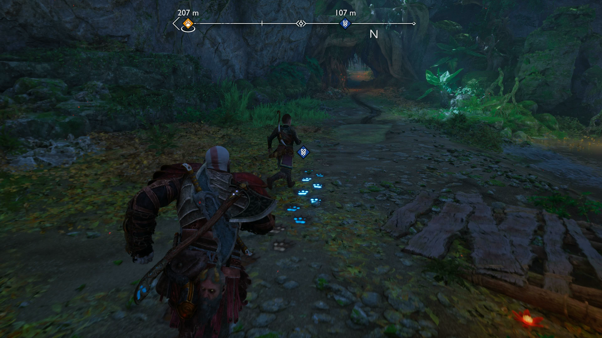 Kratos and Atreus following monster tracks in God of War Ragnarok