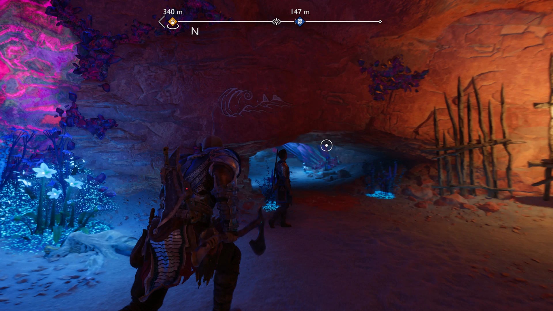 Kratos and Atreus stooping through a narrow hole in the Below in God of War Ragnarok - 13