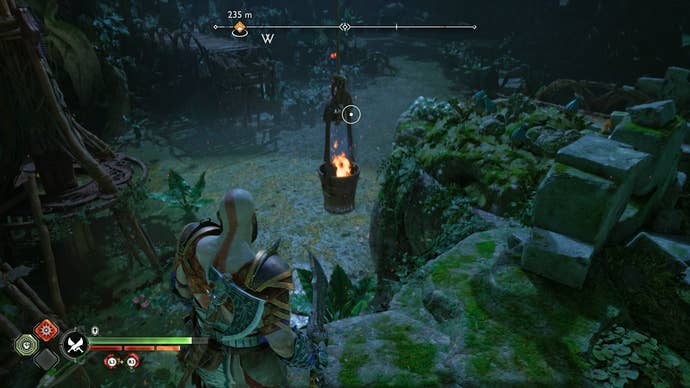 Kratos lighting the first brazier for the Nornir Chest in The Abandoned Village in God of War Ragnarok