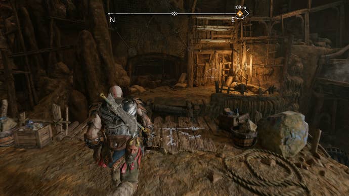 Kratos boosting Atreus up to a higher vantage point in The Applecore in God of War Ragnarok