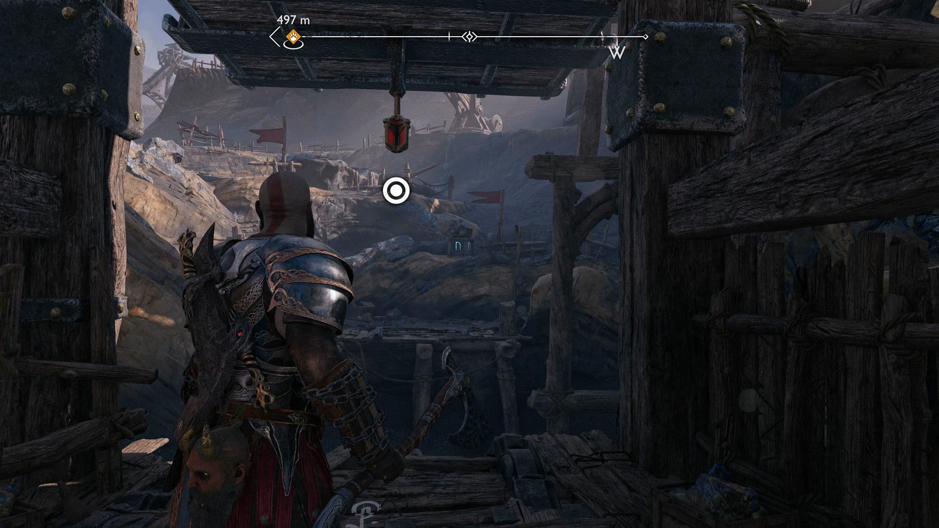 Kratos using his Blades of Chaos to swing across a gap in God of War Ragnarok