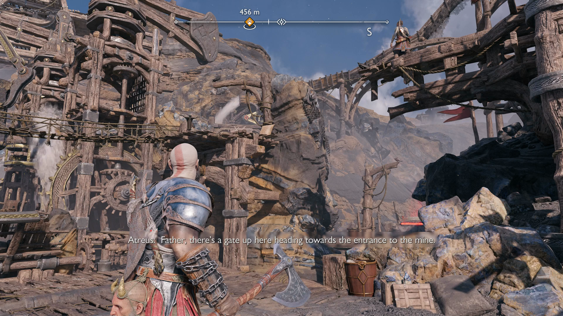 Kratos and Atreus helping each other cross a gap in Jarnsmida Pitmines in God of War Ragnarok