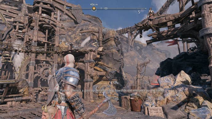 Kratos and Atreus helping each other cross a gap in Jarnsmida Pitmines in God of War Ragnarok