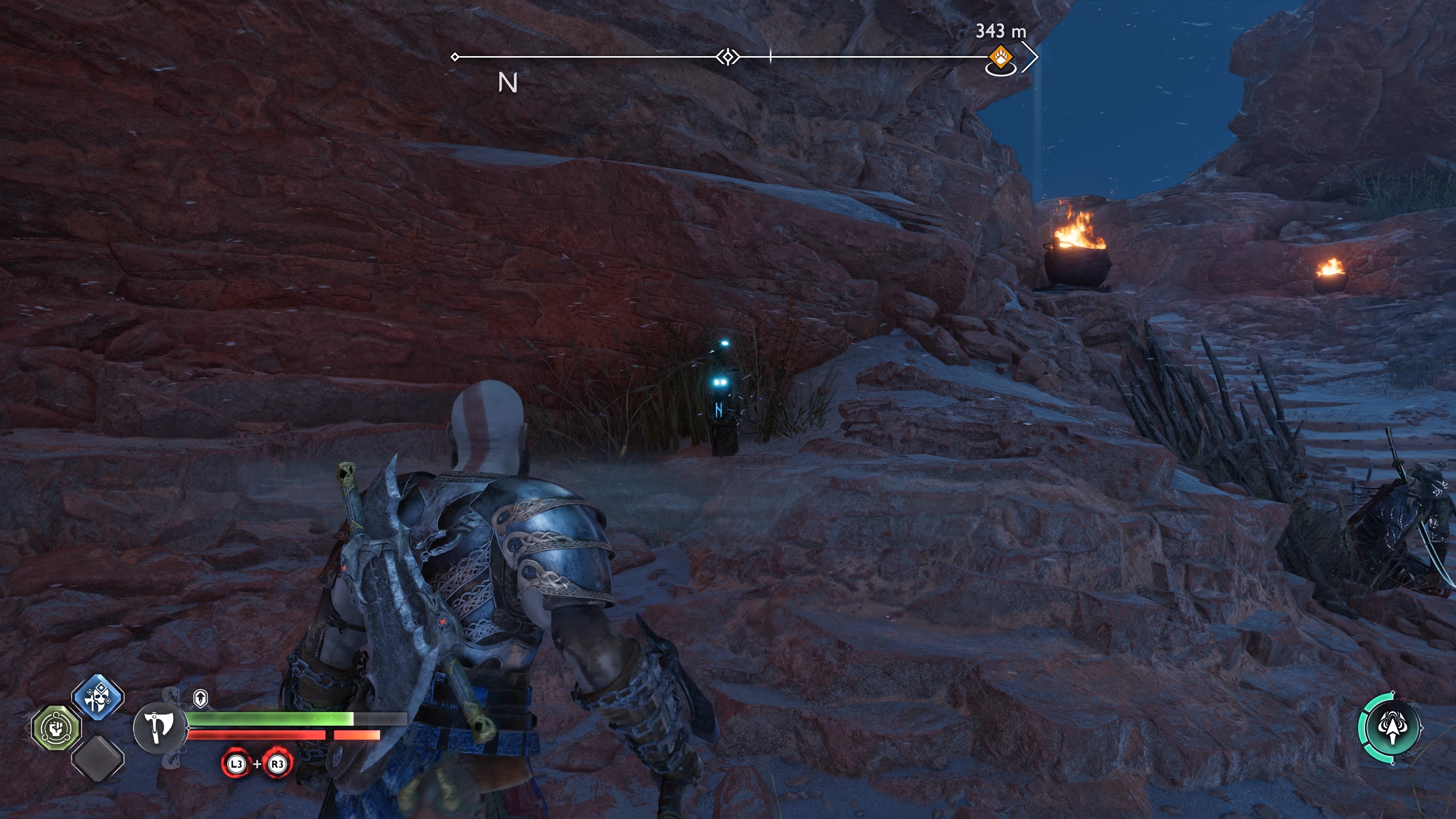 Kratos standing in front of an idol statue that unseals a Nornir Chest in The Strond in God of War Ragnarok