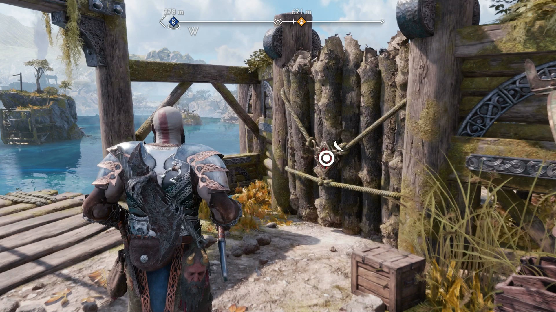 Kratos pulling open a wooden door with his Blades of Chaos is God of War Ragnarok - 21