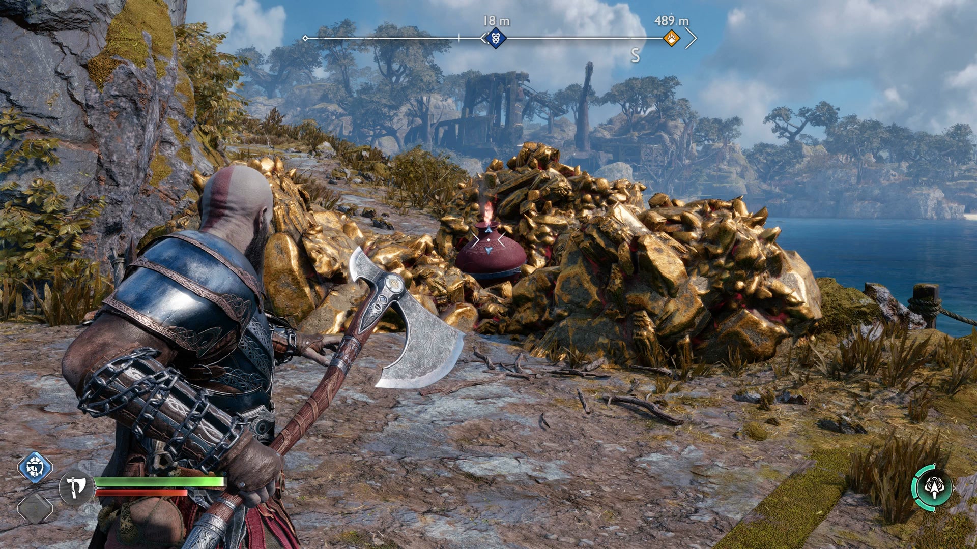Kratos readies an axe throw at the foot of a hill in God of War Ragnarok - 3