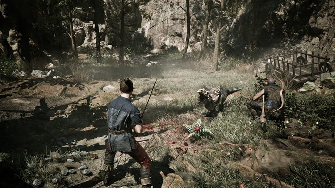 A Gothic Remake player brandishing a sword at a lizard monster in a sparse woodland area