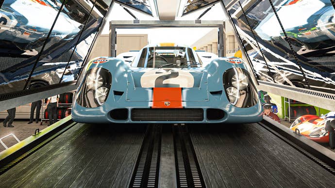 Key art from Gran Turismo 7 showing a car in the pit being reflected on different surfaces