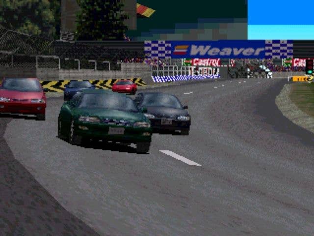 Multiple cars are shown racing one another on a racetrack in Gran Turismo