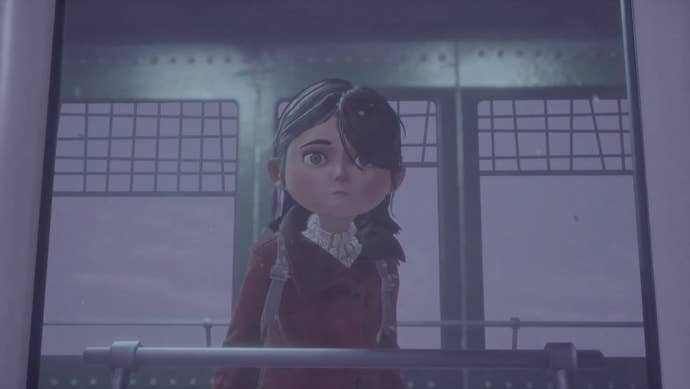 Little girl in red jacket looks sadly out of a window in a screenshot from Gylt