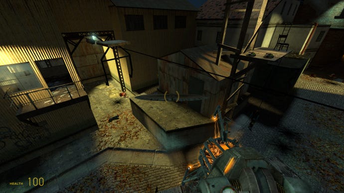 The player looks down on a mill yard in Half-Life 2