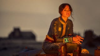 An image of the Fallout TV show, showing Lucy sat on a log in the wasteland.