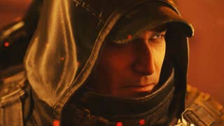 Hell is Us screenshot showing a male character wearing a cap and his hood up illuminated by an orange firy glow