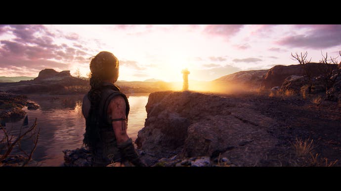 Hellblade 2 screenshot showing Senua standing in front of a beautiful sunset
