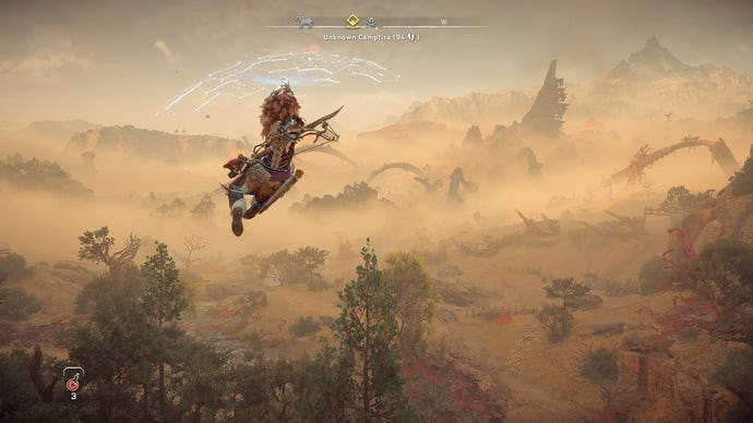 Aloy uses her Shieldwing to glide off a cliff in Horizon Forbidden West.