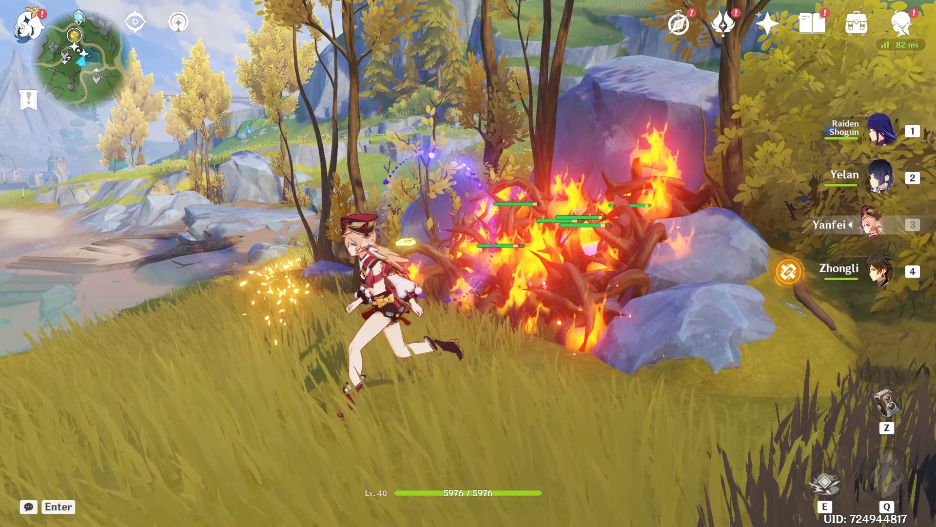 Yanfei running away from branches on fire in a yellow grassy area.