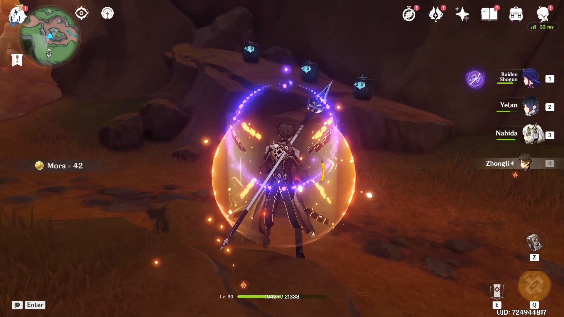 Zhongli looking at three small totems on a small brown ledge.