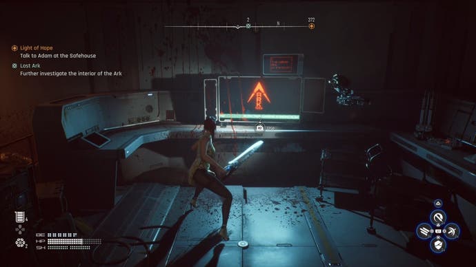 Eve with her sword out looking at a terminal in a dark facility in Stellar Blade.