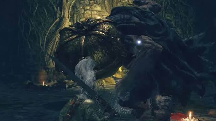 Fighting the Mad Pumpkin Head boss in the Waypoint Ruins in Elden Ring.