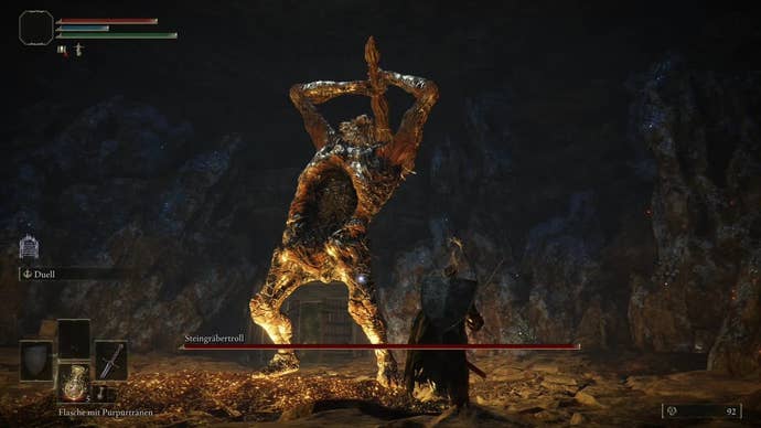 Fighting the Stonedigger Troll in the Limgrave Tunnels in Elden Ring, while the boss has his club raised in the air.