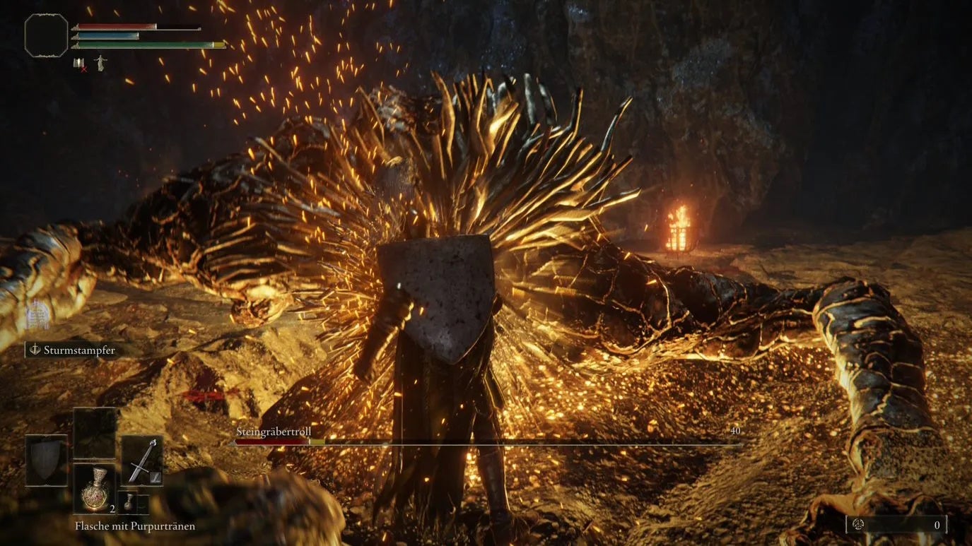 Hitting the Stonedigger Troll while its downed in the Limgrave Tunnels in Elden Ring.