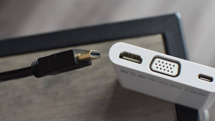 Step 1 of how to connect a Steam Deck to a TV with an adapter: connect your HDMI cable from your TV to your USB-C-to-HDMI adapter. Then, plug the adapter into your Steam Deck’s USB-C port.
