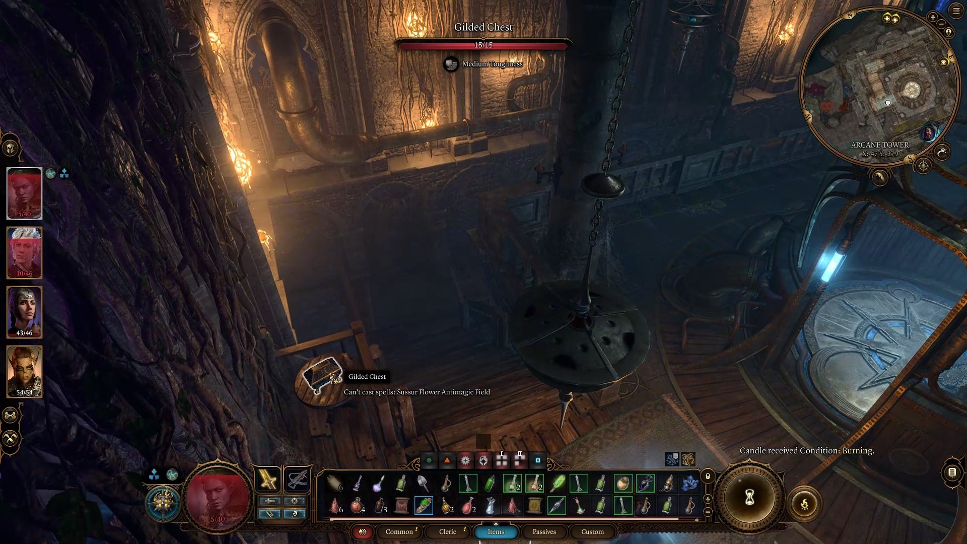 Cursor on a small gilded chest on a small table in a dark room lit by torches.