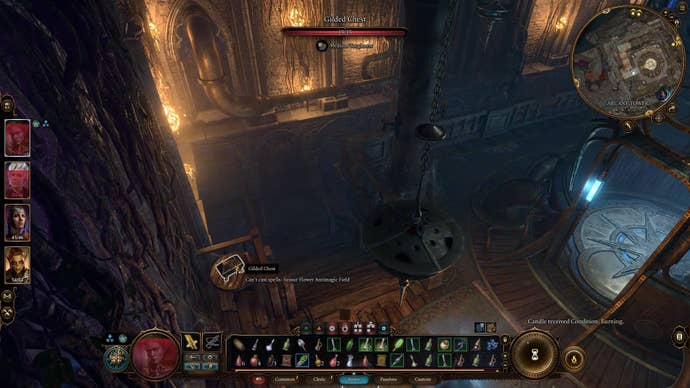 Cursor on a small gilded chest on a small table in a dark room lit by torches.