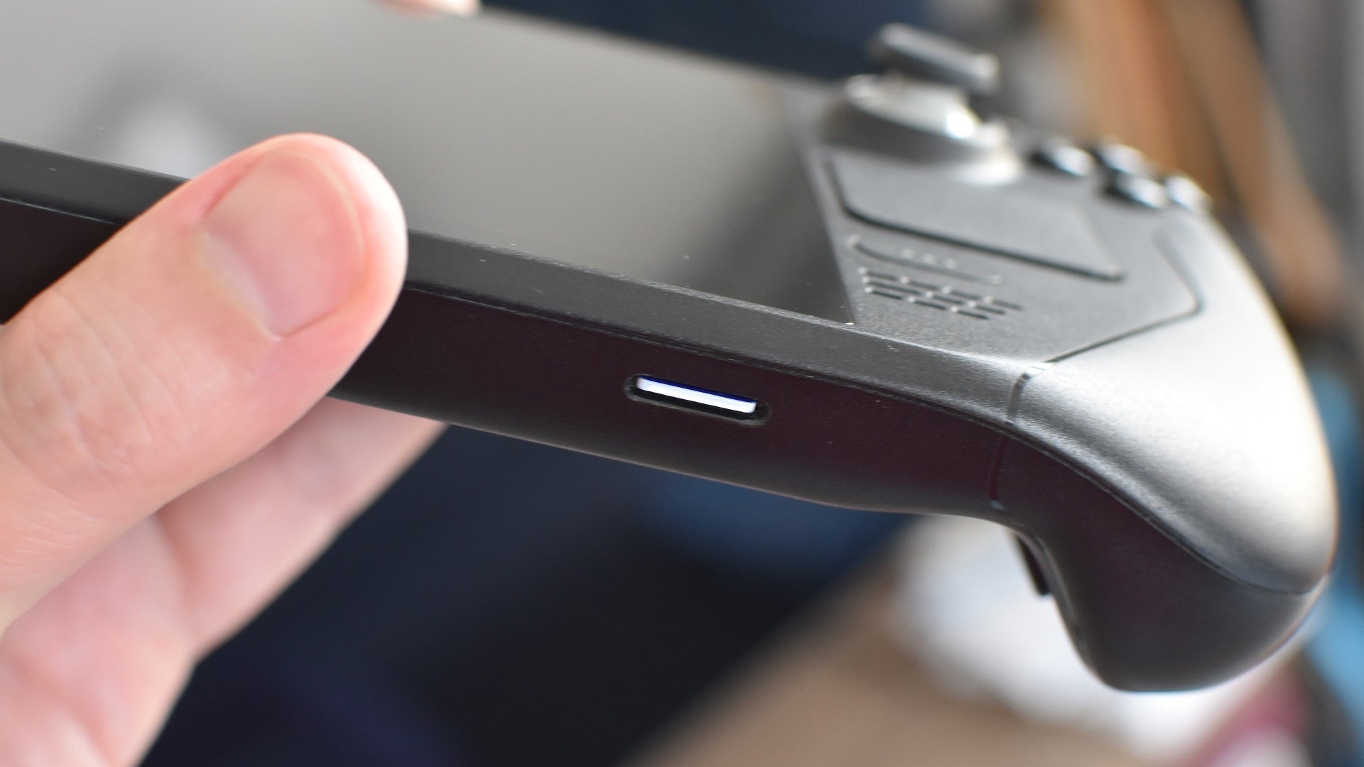 Step 1 of how to format a microSD card on the Steam Deck: Fully insert the microSD card into the slot.