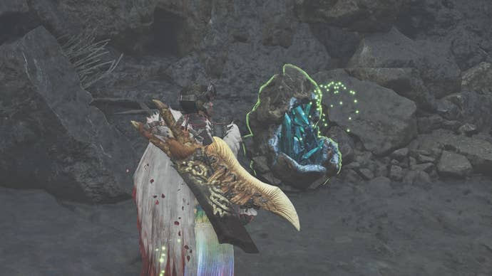 Hunter looking at a Mining Outcrop in the Basin region of Monster Hunter Wilds.