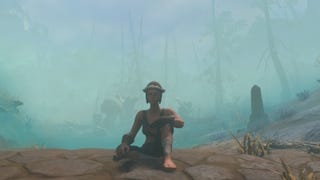 A female character in Enshrouded with beginner gear equipped sitting down inside a Shroud area covered in fog, near trees.