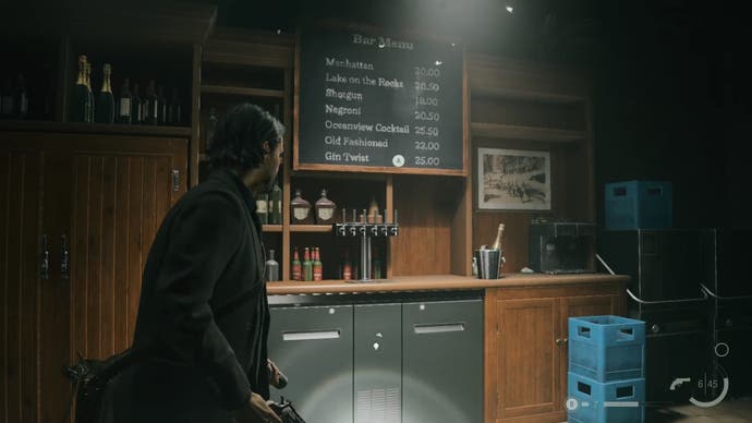 alan looking at a chalkboard drinks menu inside a bar with wooden paneling