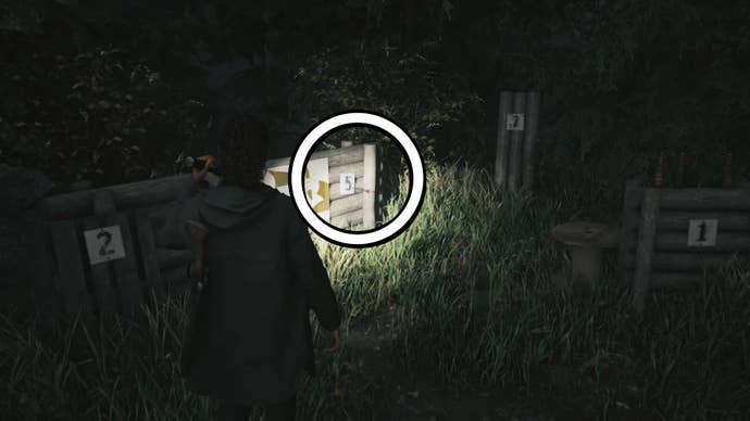 saga using her flashlight to see a ‘5’ sign on a small wooden wall with one arrow going through it