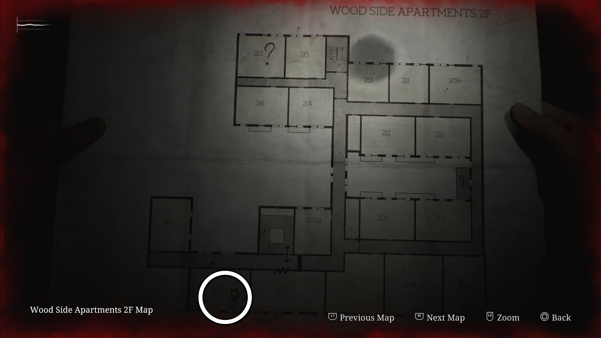 White circle showing the Flashlight location in Room 202 of Wood Side Apartments in Silent Hill 2.